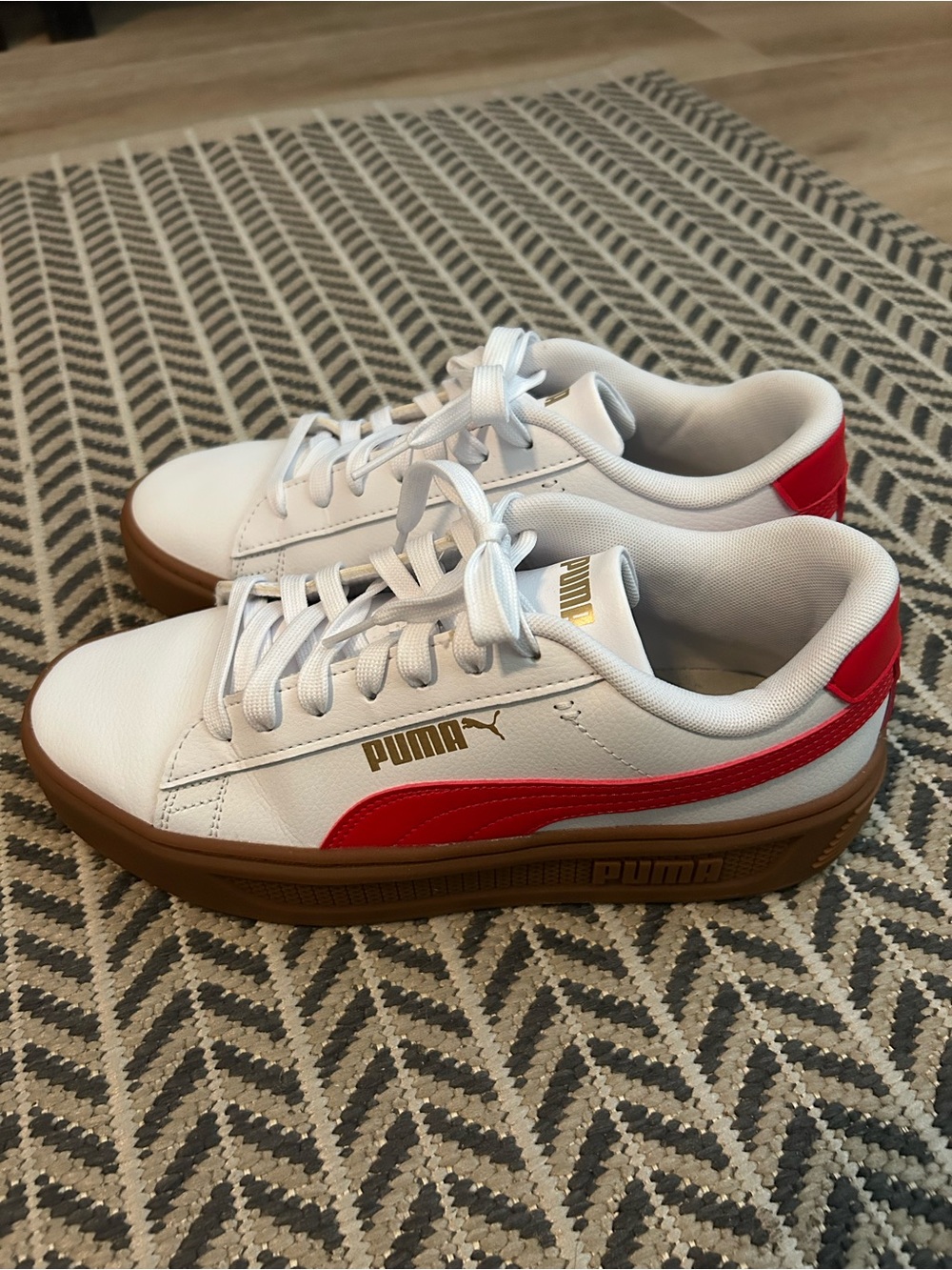 Puma Smash Platform sneakers in white and red with a gum sole